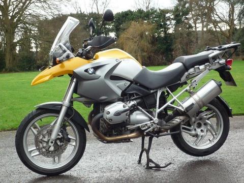 Yellow BMW R1200GS with luggage