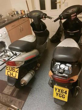Two 50cc scooters running